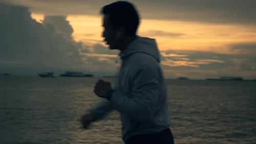 Man Silhouette Shadow Boxing During Sunset by Ocean