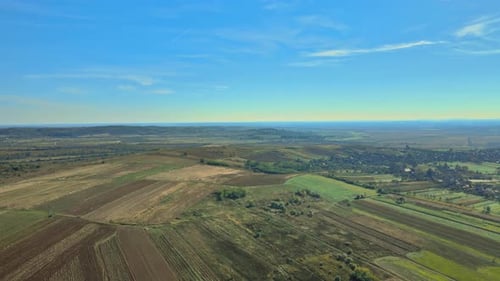 Aerial View of Green Countryside in View of Summer Field