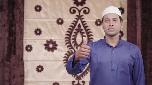 Adult Man Gives Thumbs Up Indoors