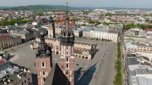 Flying over Main Square, Rynek Glowny in Krakow, Cracow city in Poland, Polska