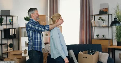 Couple Celebrates Moving into New Home with Boxes