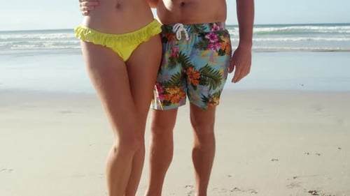 Couple taking selfie on mobile phone at beach