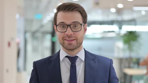 Young Adult Speaks in Modern Office Setting