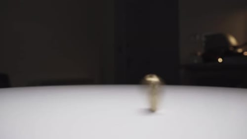 Bitcoin Spins on White Surface