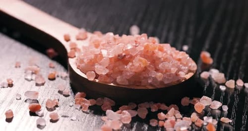 Pink Himalayan Salt Crystals in Wooden Spoon, Macro