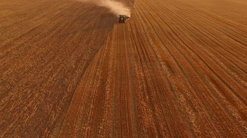 Tractor Ploughing Field, Aerial View.