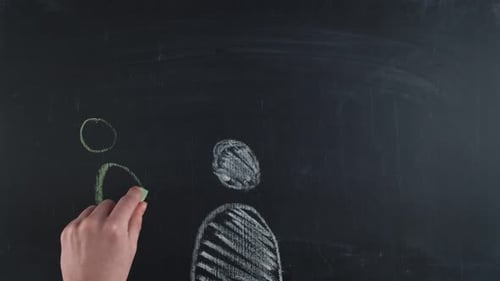 Stick Figures Drawn on Blackboard with Chalk