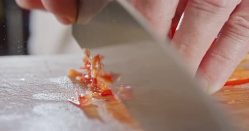 Close Up Dicing Red Bell Pepper with Knife
