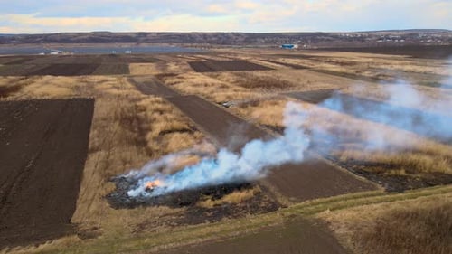 Aerial View of Grassland Field Burning with Red Fire During Dry Season