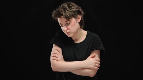 Injured Woman Standing with Arms Crossed