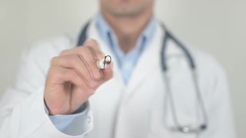Doctor Writing Best Doctor on Glass Surface