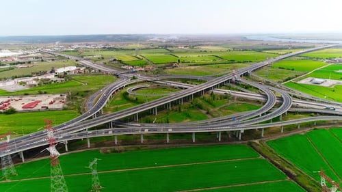 Aerial View of Highway Interchange and Green Fields