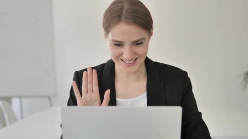 Close Up of Video Chat By Young Businesswoman on Laptop
