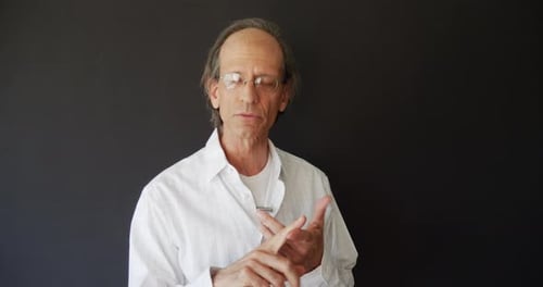 A college professor teaching remote learning online classes to school students on a video chat webca