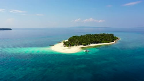 Island with a Tropical Beach and Turquoise Lagoons. Tropical Island on a Coral Reef, Top View.