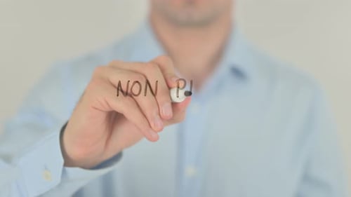 Man Writing Non Profit Organization with Marker