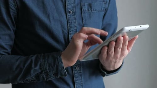 Person Using Tablet With Touchscreen Technology