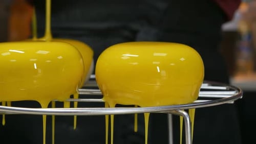 Yellow Glaze Dripping on Sweet Desserts