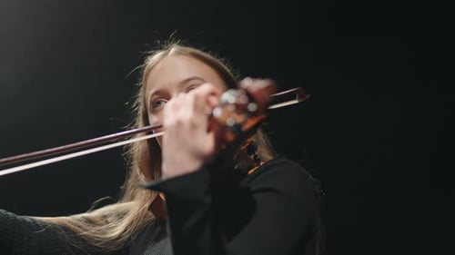 Inspired Female Fiddler is Playing Classic Music Concert in Philharmonic Hall Violinist is Playing