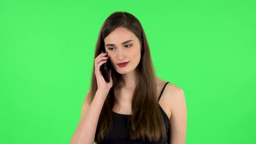 Girl Talking for Mobile Phone, Very Shocked. Green Screen