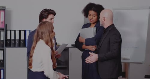 Male and Female Colleagues in Meting at Office