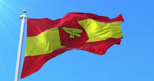 Realistic Waving Flag with Stylized Emblem Against Blue Sky