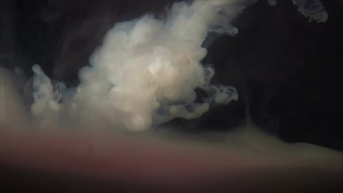 White Smoke Cloud Expanding on Dark Background