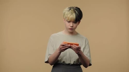 Engrossed Young Adult Mobile Gamer