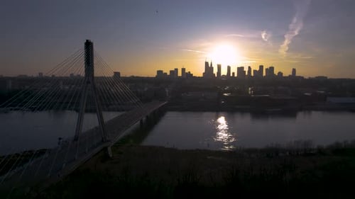 An onward aerial drone shot of a sunset from Warsaw, the capital city and largest city in Poland. Th