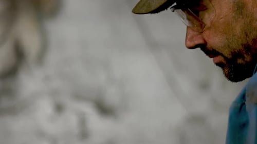 Adult Man with Glasses and Cap Close Up