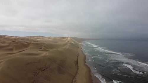 Amazing contrast, huge sand dunes and gorgeous Atlantic ocean, Namibia