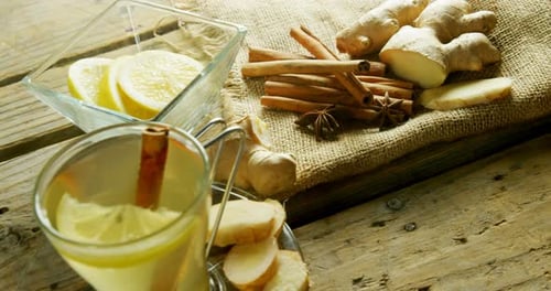 Herbal tea with lemon, cinnamon sticks and ginger 4k