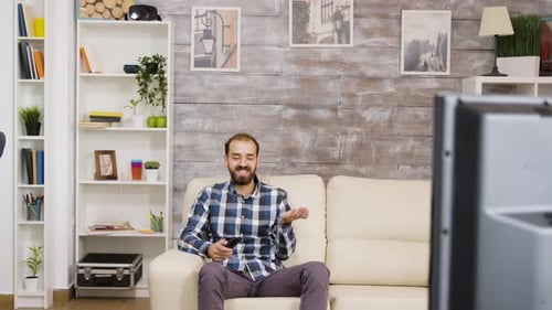 Man Watching TV in Living Room, Relaxing