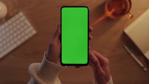 Close Up of Woman Holding Mobile with Chroma Key Screen