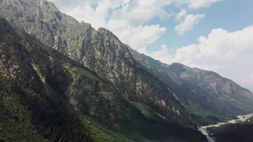 Mountain Ridge Covered with Forest Under Blue Sky