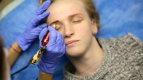 Tattooist Making Permanent Make-Up