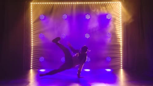 Man Performing a Breakdance Routine on Stage