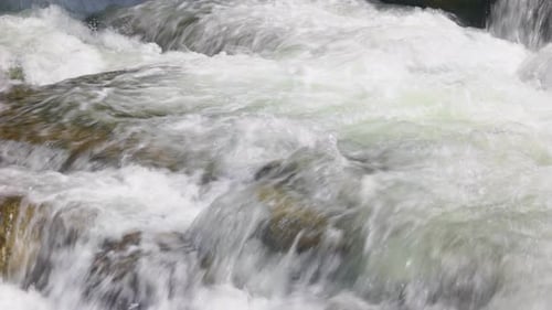 Powerful Flow of Water Over the Stones