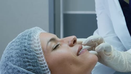 Woman Receiving an Injection at a Hospital