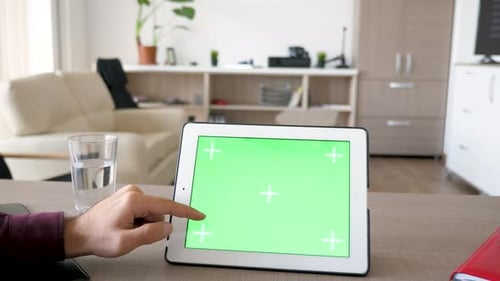 Hand scrolling on Tablet with Green Screen Display