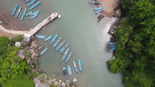 Aerial view of traditional boats in lagoon beach in Indonesia