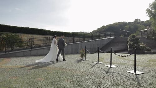 Lovely Newlyweds Caucasian Bride Groom Walking in Park Holding Hands Wedding Couple Family