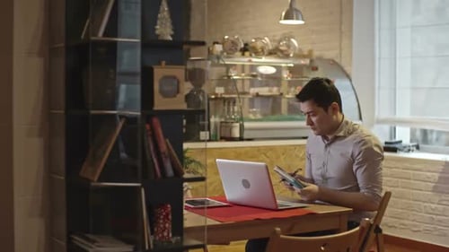 Cafe Owner Busy Working