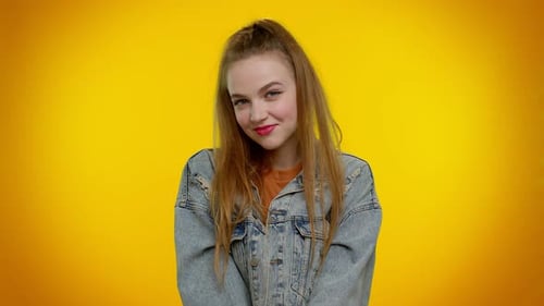 Smiling Playful Happy Girl Blinking Eye Looking at Camera with Toothy Smile Winking and Flirting