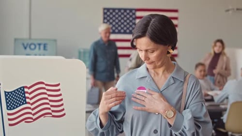 Woman Proudly Wearing 'I Voted' Sticker at Polling Place