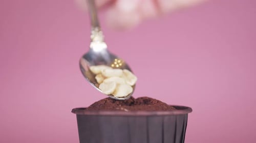 Garnishing Chocolate Cupcake with Sliced Almonds