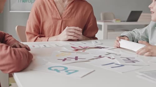 Teacher Helps Children Learn with Flashcards