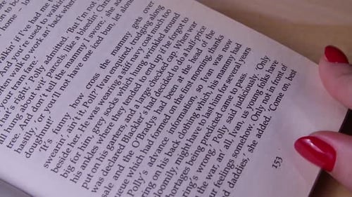 The Girl Flips Through the Pages of the Book with Her Hand in Search of the One She Stopped at