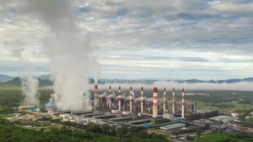 Aerial view Steam or mist over of Power Plant with smoke and toxic air from cooling,