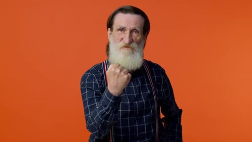 Serious Senior Man Making a Fist